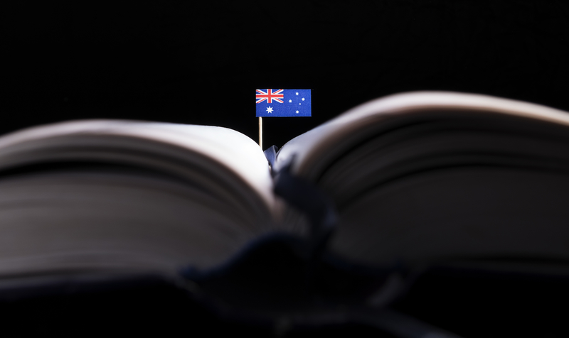 Australian flag in the middle of the book. Knowledge and education concept.
