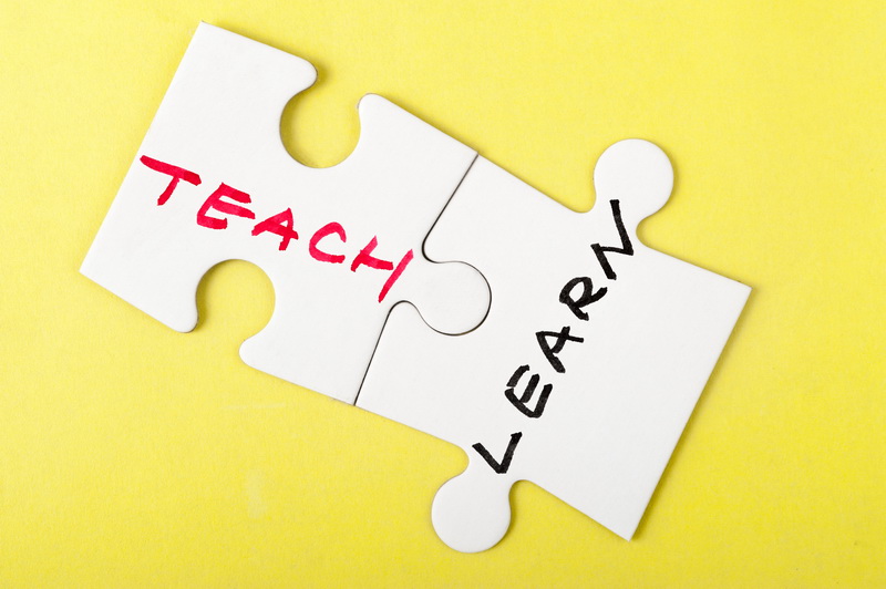 Teach and learn words written on two pieces of puzzle
